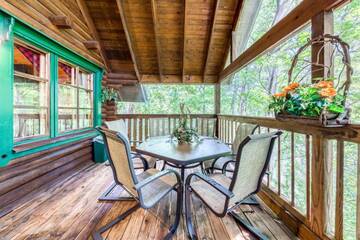 Porch seating for meals in the forest.